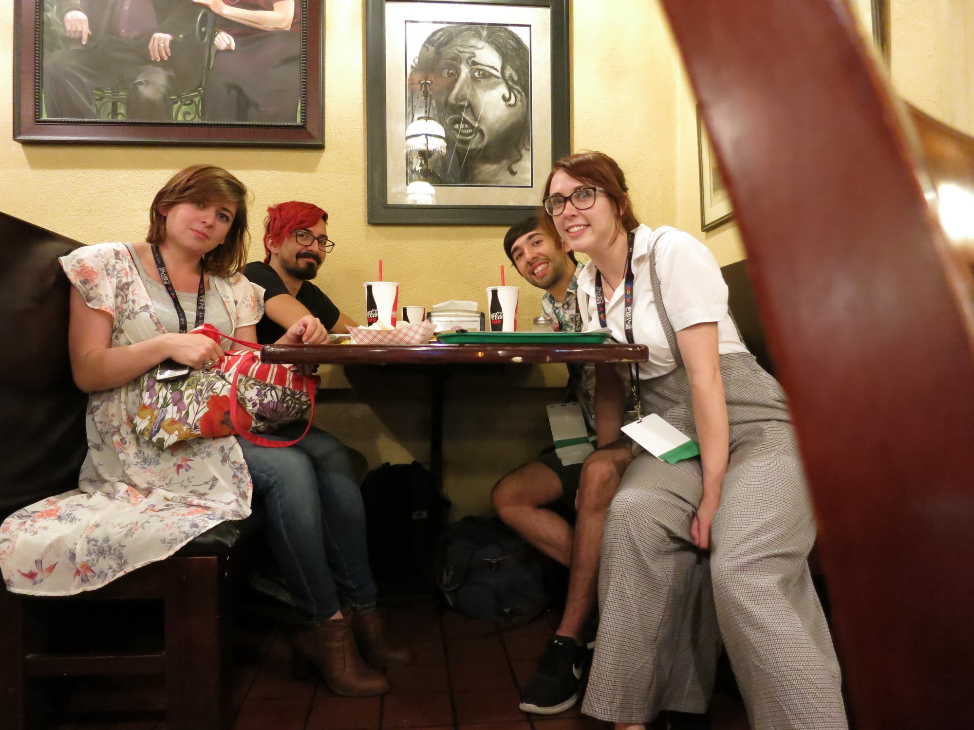 Mariana Palova, Cody Jimenez, Gonzalo Alvarez, and Grace Chadwick bonding over food at Worldcon 76 (Photo by Anonymous, taken on Gonzalo's phone)