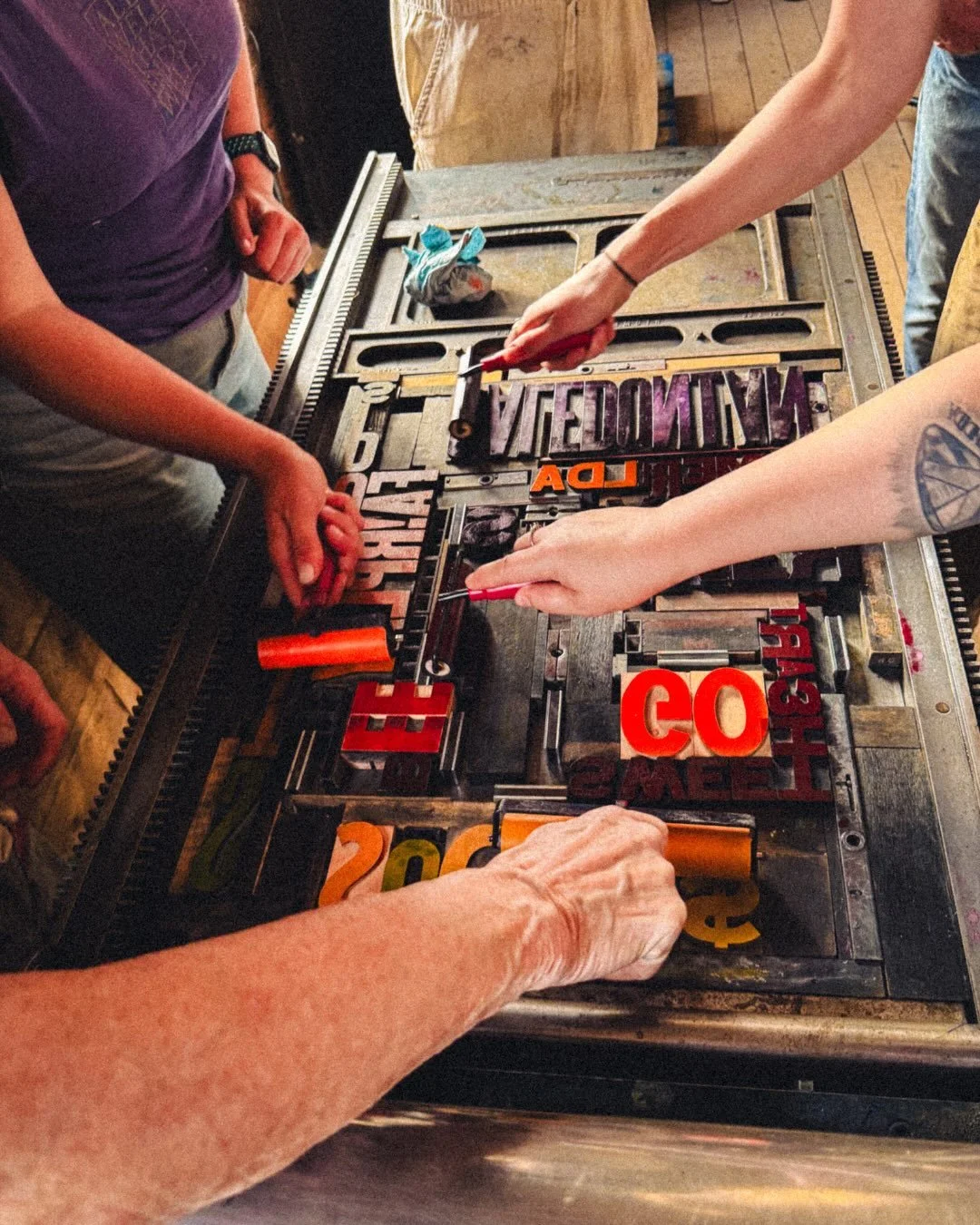 Sone great photos from the first day of Week 1 of the Print &amp; Publishing summer intensive! Each student picked a word from a historic poster or article printed at the Dawson Daily News building. The words were assembled into a text collage poster