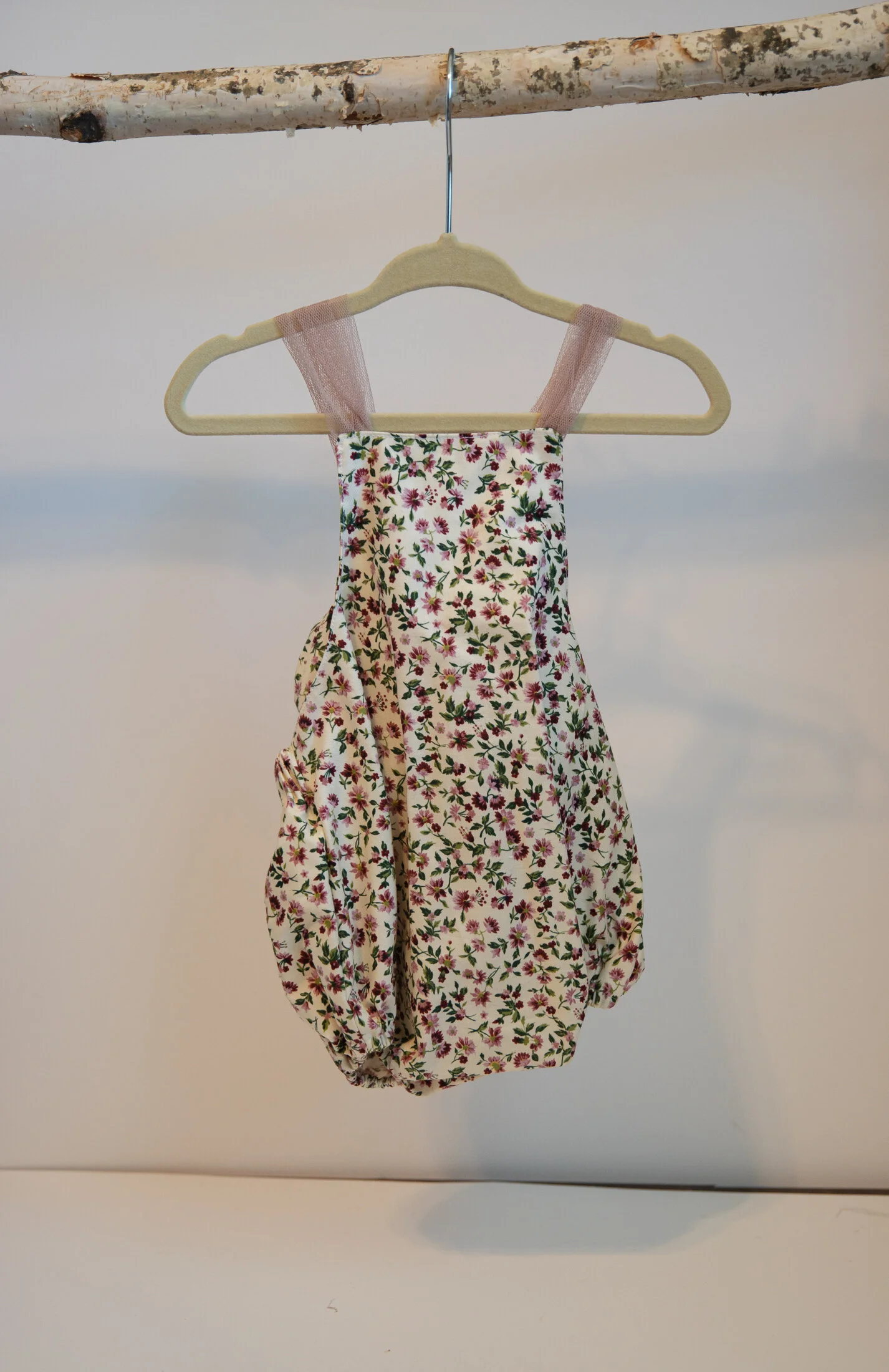 Size: 6 MonthBurgundy and Mauve Floral Romper