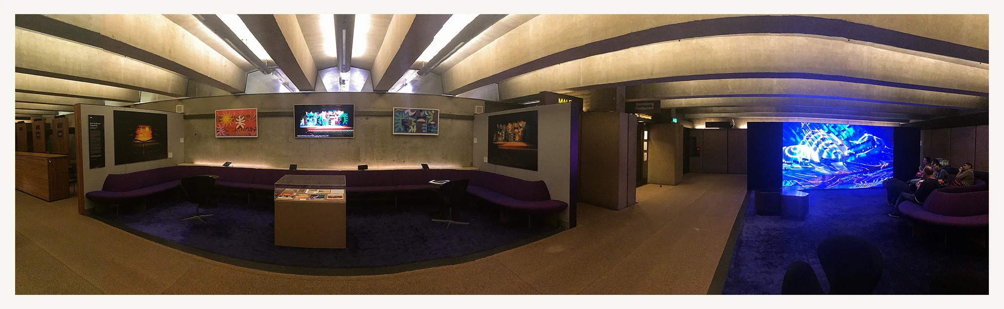 Panorama of The Lounge at Sydney Opera House. Exhibit space shows the curtains in 1973 alongside the original (painted) designs. Also a video slideshow and display box of ephemera.