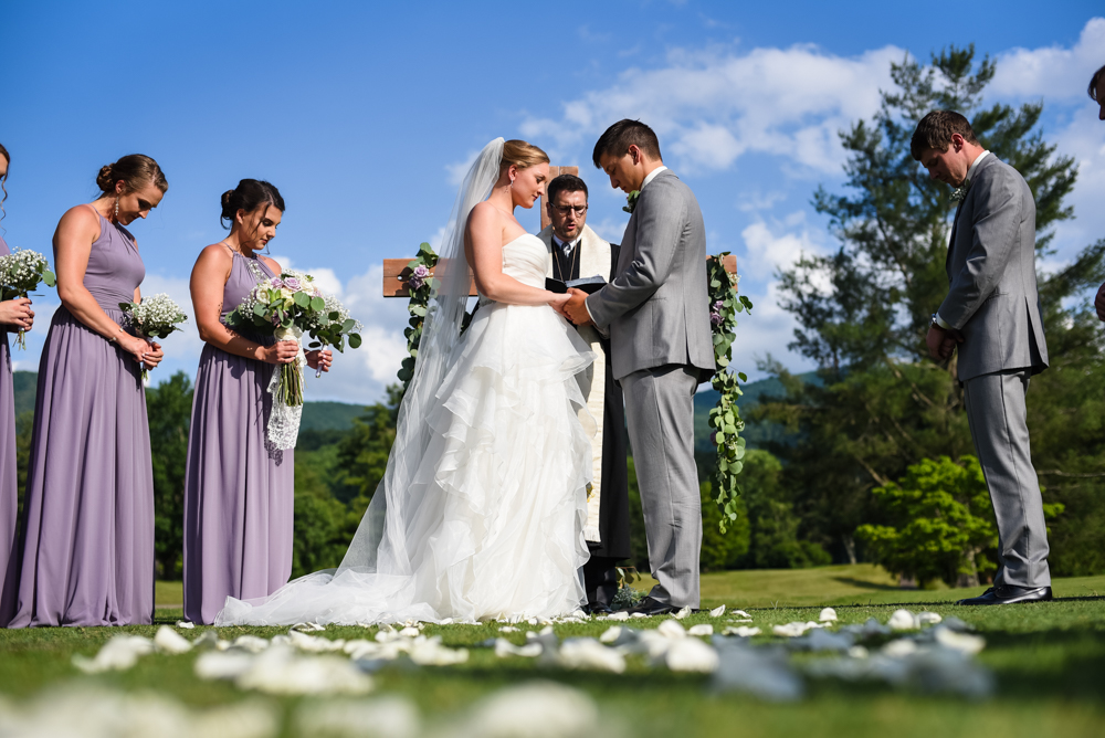 wedding ceremony, bride and groom praying