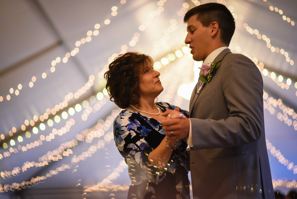 groom and mother dancing at wedding reception