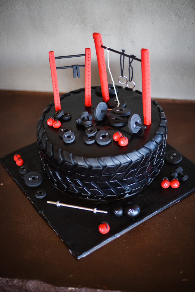 wedding cake decorated with gym equipment