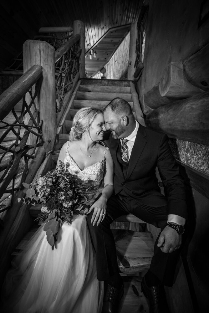 Gatlinburg mountain wedding bride and groom on staircase inside mountain cabin
