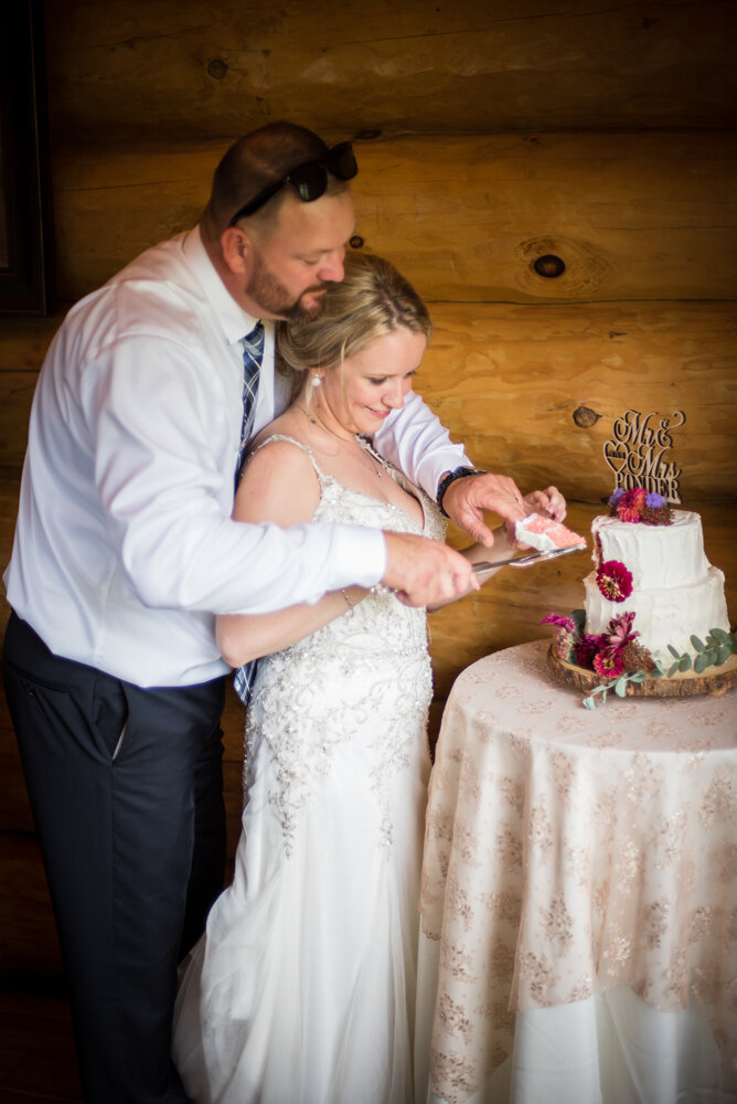 Gatlinburg mountain wedding bride and groom cutting cake