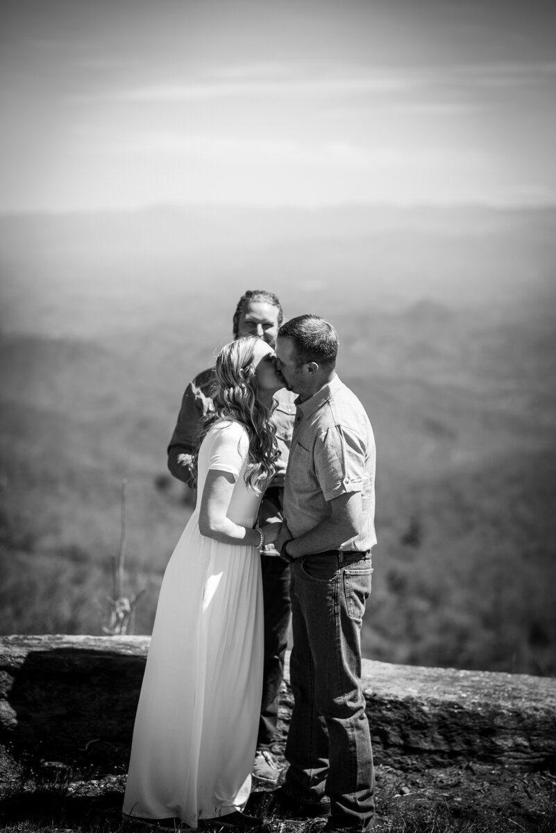 Bride and groom's first kiss after mountaintop ceremony