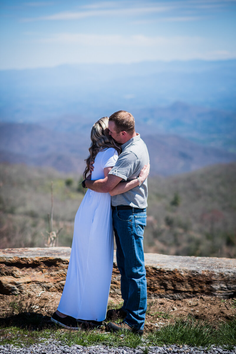 Bride and groom hug after mountaintop elopement