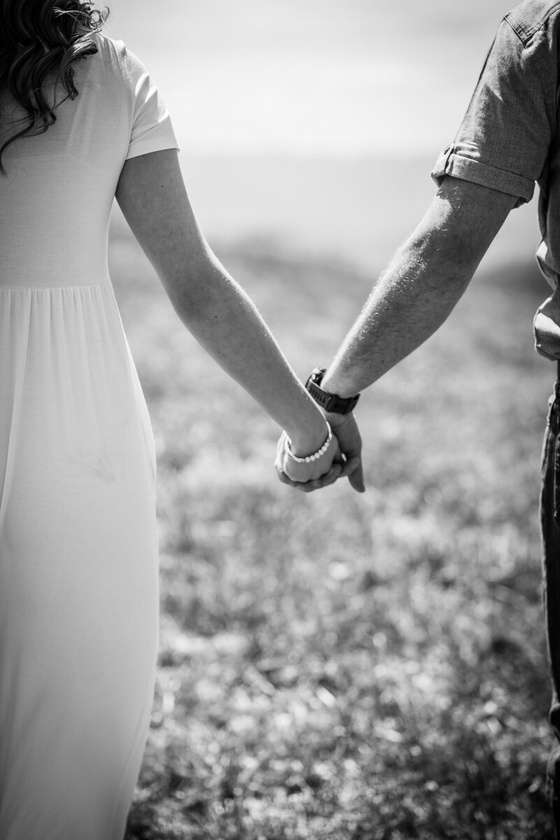 Bride and groom holding hands