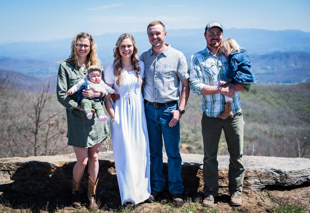 Bride and groom with family