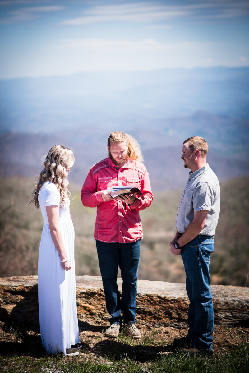 Bride and groom eloping at mountaintop wedding