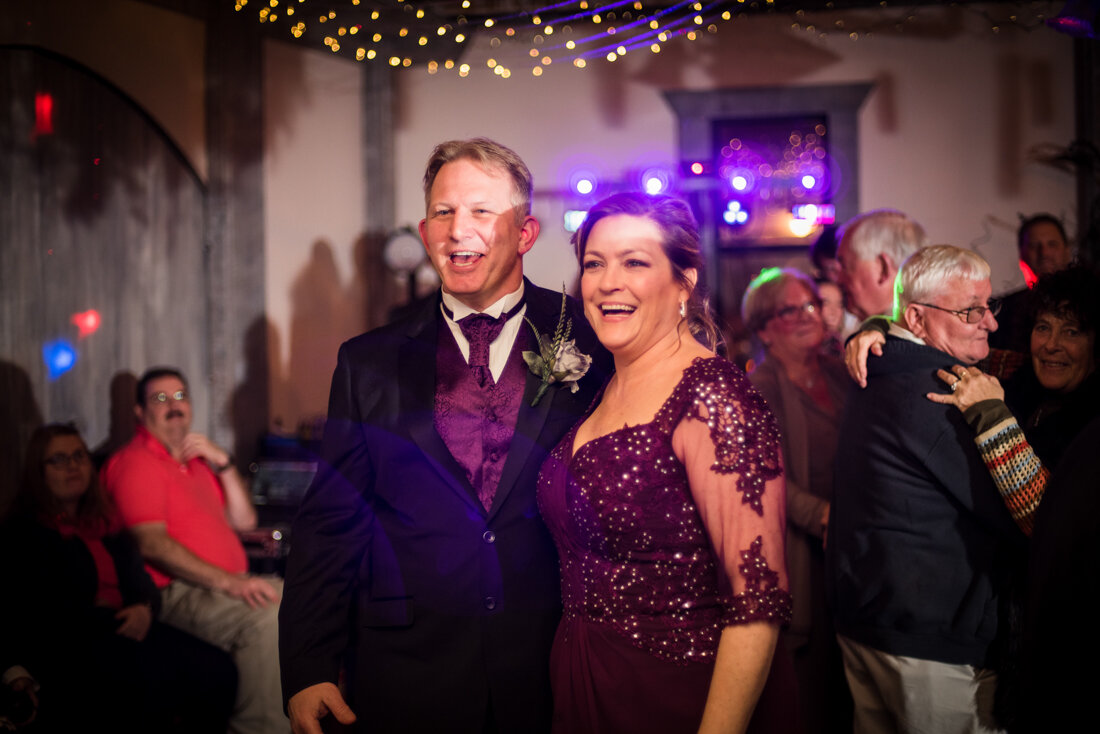 Couple smiling at wedding reception