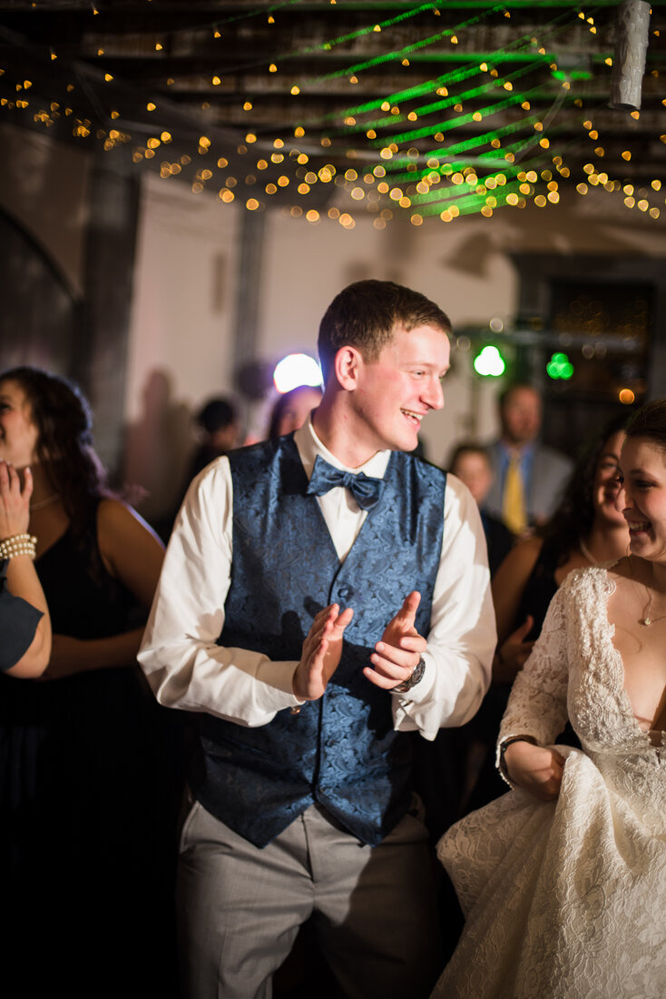 Groom and bride dancing at wedding reception