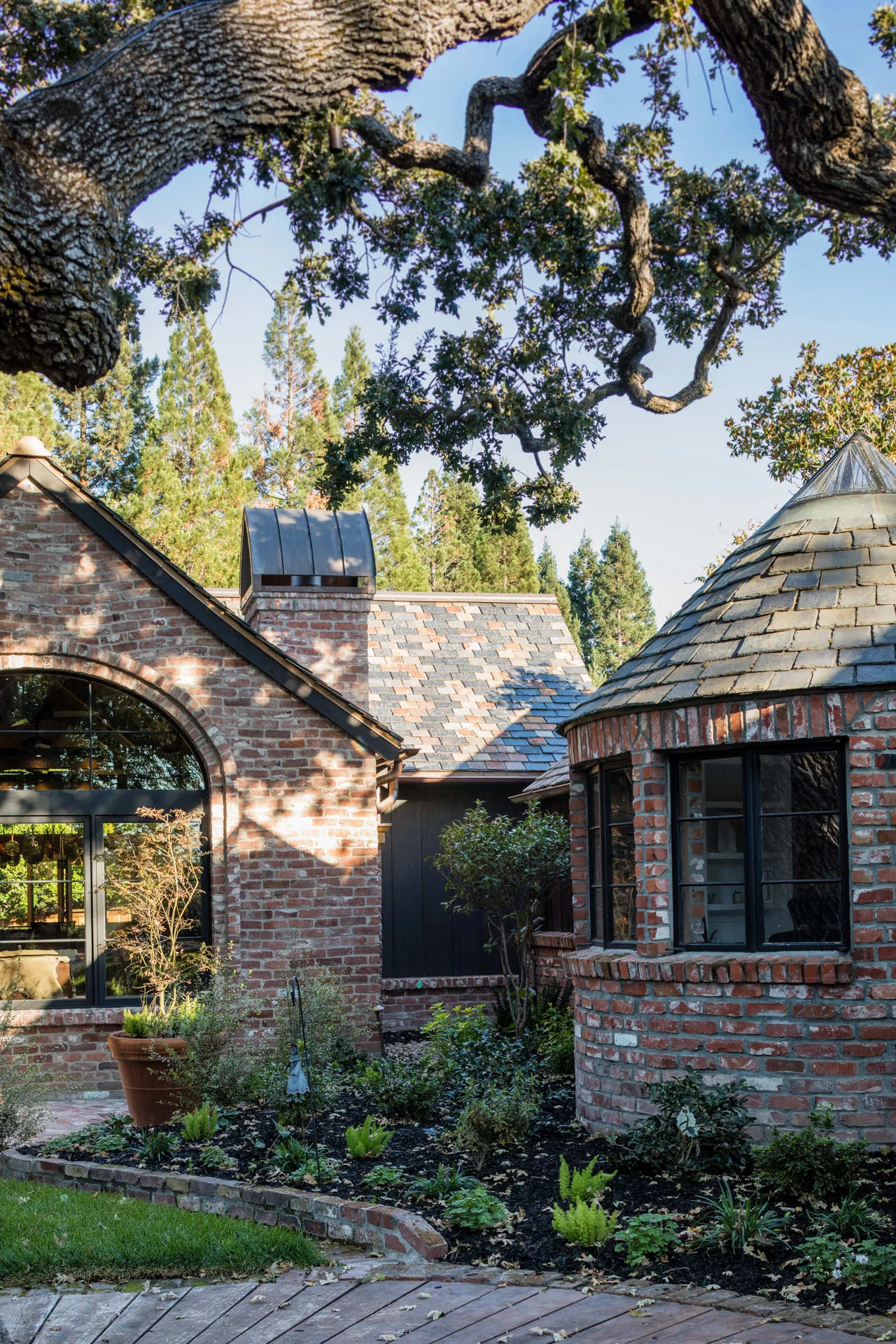 Turret building adjacent to cottage is used as an office/studio.