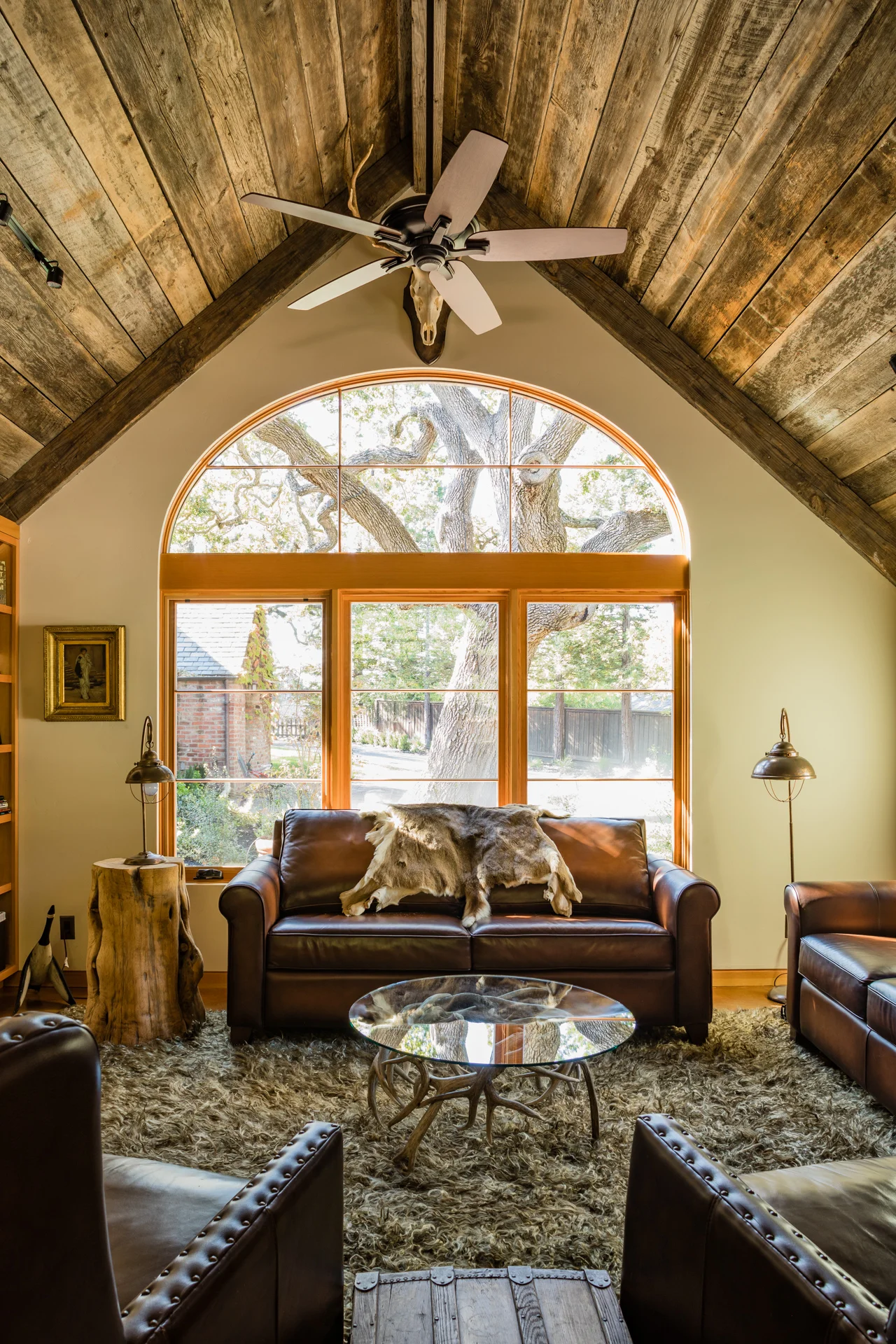 Living Room with large window with view of oak trees.