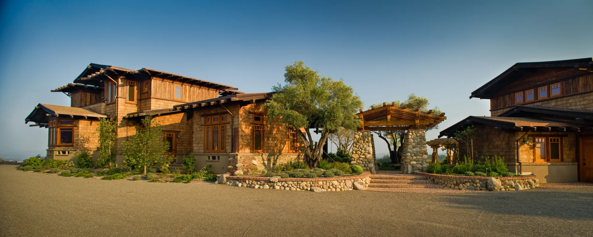 Exterior view of house, entry way and guesthouse
