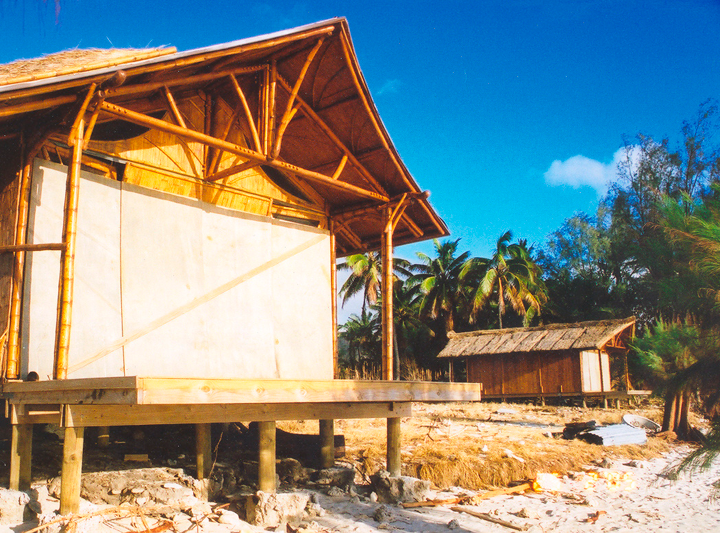 Bamboo Living cottage in Rarotonga after hurricane Olaf. Windows boarded up to protect the glass.