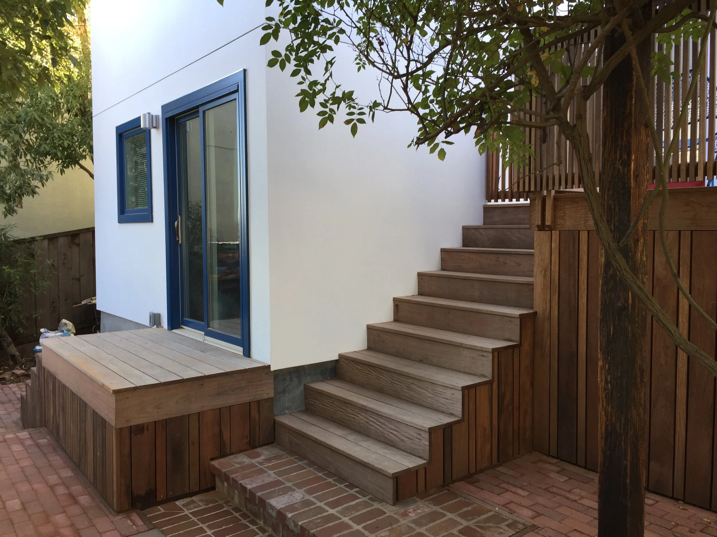 Landscape brick work, machiche wood staircase/deck and painting.