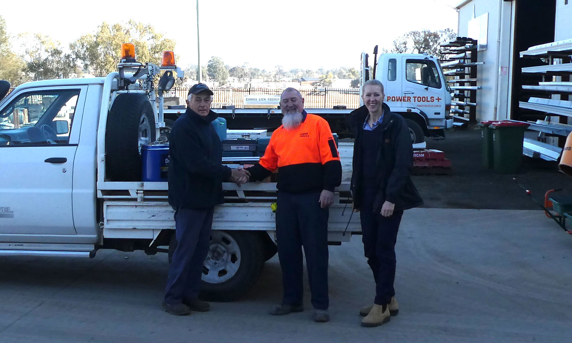 Forbes Men’s Shed President Norm Haley receiving a donation from Power Tools Plus Product Manager Wayne Parsons, and Marketing Manager Carrie Olsen.