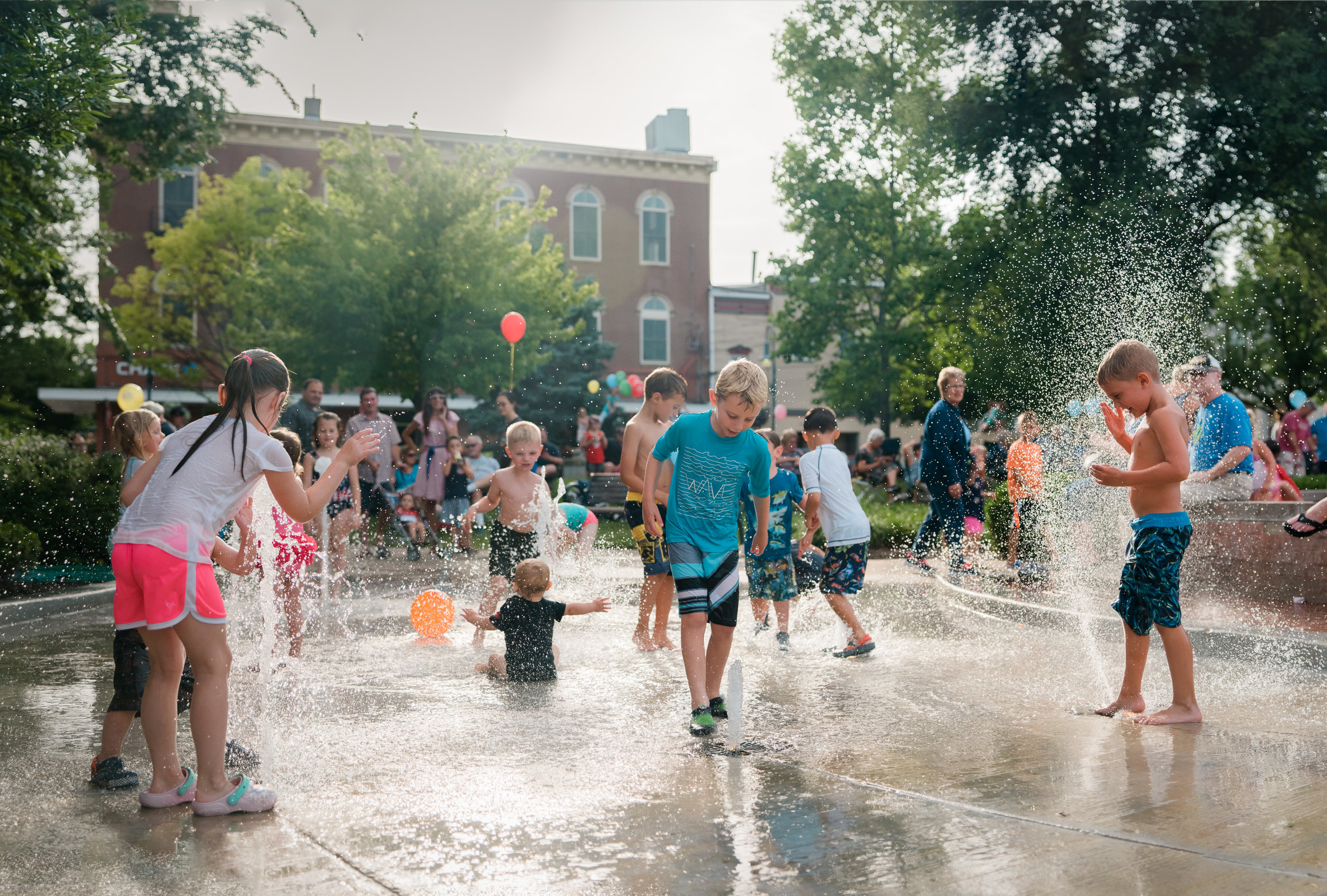 Kids playing in Fountain - photo by Ron Hautau.jpg