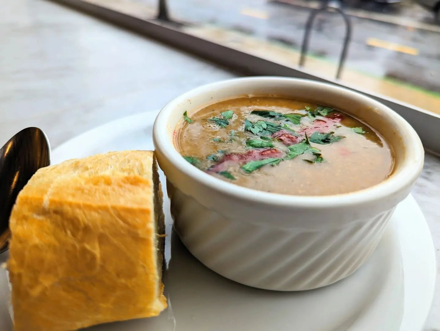 Best thing about a rainy day like this? Cozying up with a warm bowl of our Tunisian Chickpea soup!

Our take on lablabi isn't as thick as it traditionally is but we'll absolutely top it with harissa for anyone that wants a little more heat on this dr