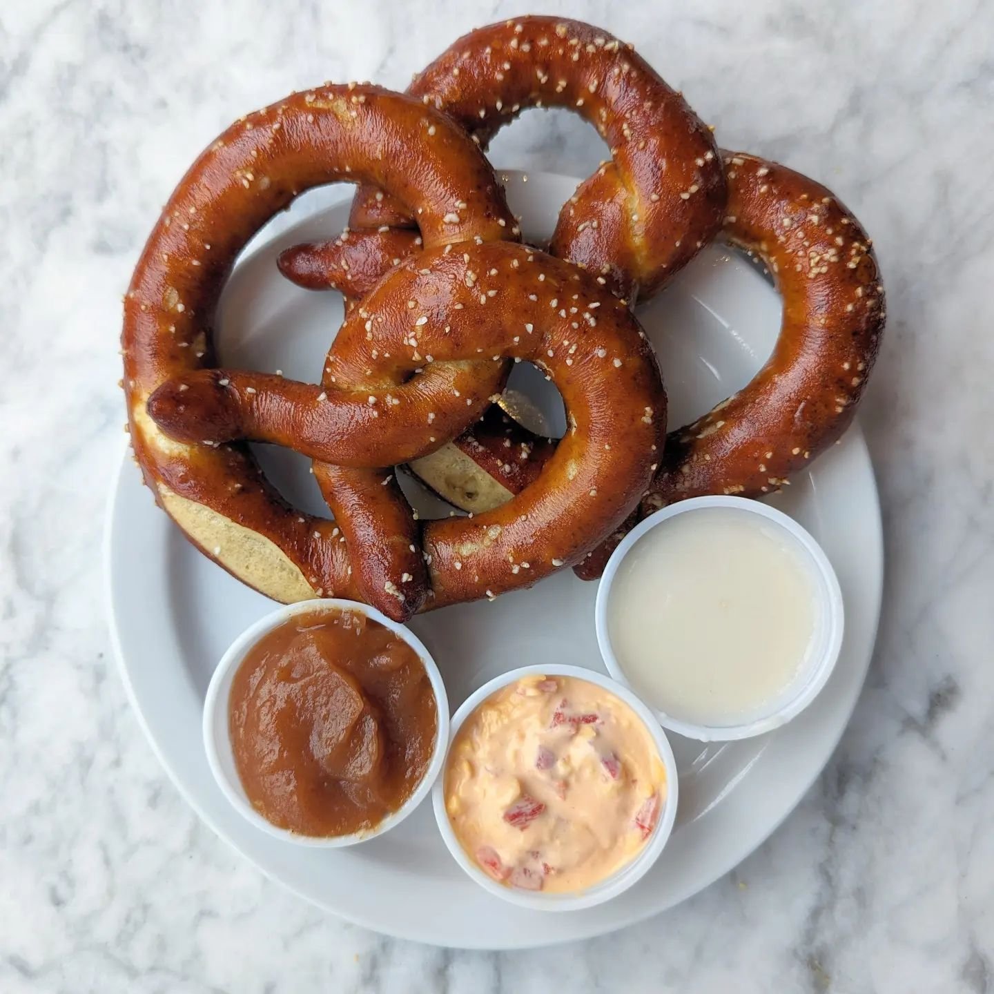 Sarkozy pretzels! Available at the bakery this Sunday along with the return of Kalamazoo blues legend Tom Duffield!

We'll have some Sunday breakfast favorites, nests, quiche, and pastries. But if you've always dreamed of a brunch pretzel -OH! Today 