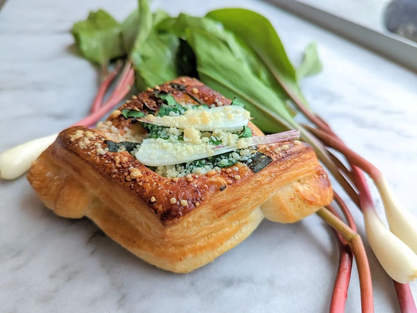Ramp parmesan croissants are here!!!

We're pretty excited about this. Not just because they're delicious (they are), but because it means that summer is truly on the way. Ramps are some of the first bit of growth in Michigan wilderness, blanketing t