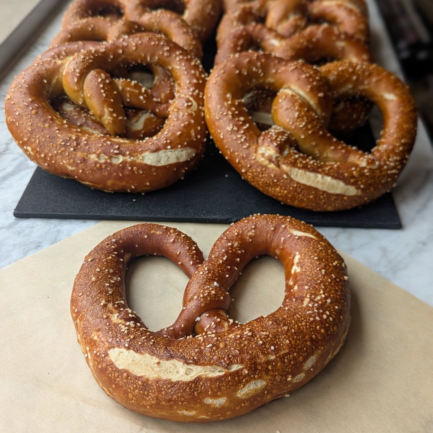 Rye sourdough pretzels JUST came out of the oven!

We had an order of these for @breweryoutre (where you can get them with a delicious pint of beer Wednesday - Sunday), so we decided to make a few extra to see if any customers were interested. We hop
