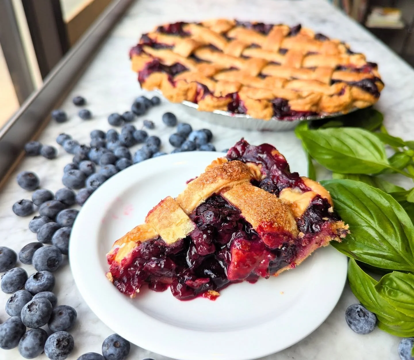 The best pie is a messy pie! And this blueberry basil pie is a testament to that.

Sometimes we go to great lengths to make a product &quot;shelf ready&quot; or photographable along with delicious. After all, people often eat with their eyes first. B