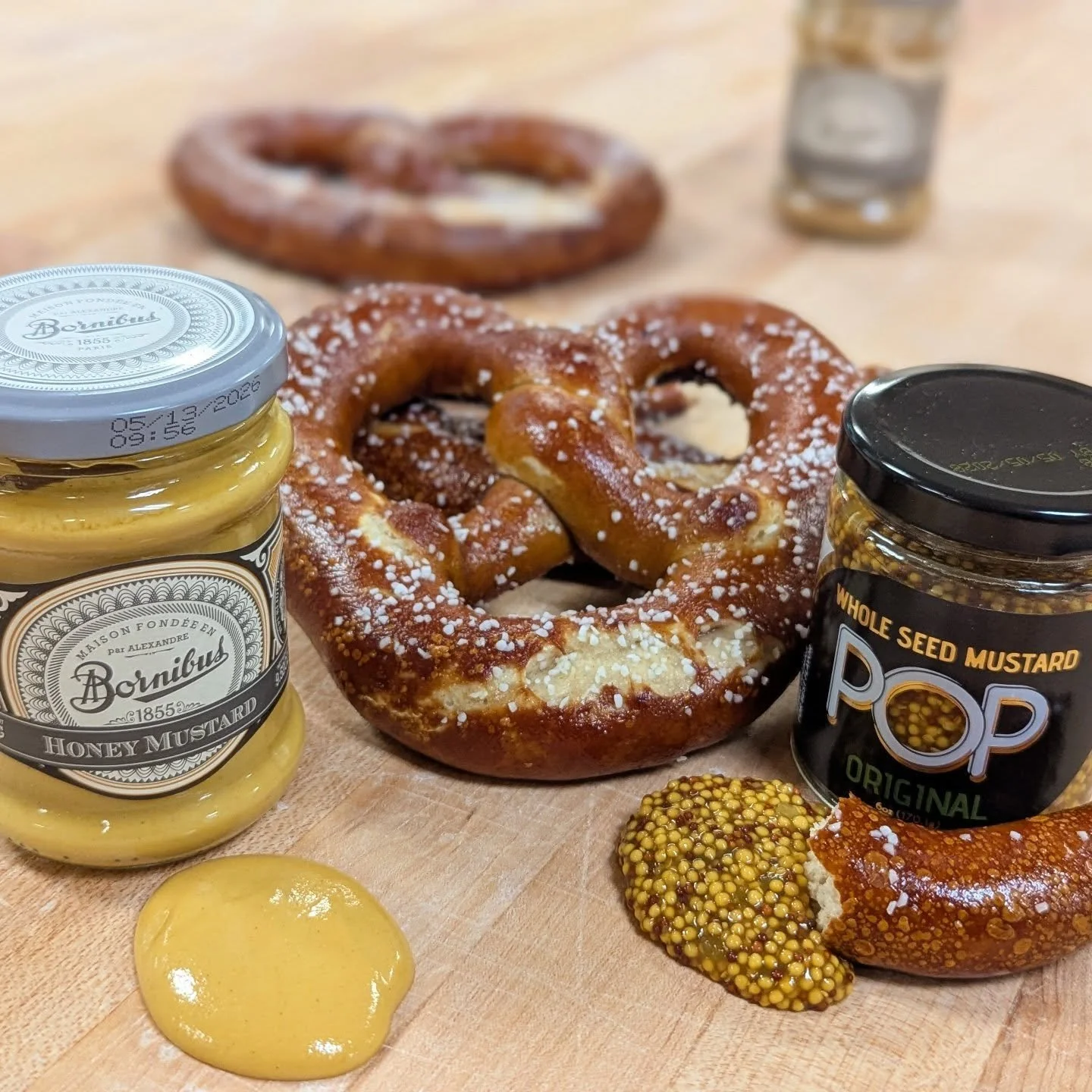 Thursday is pretzel day! And we've got a fun announcement to go along with this one. We've got a few delicious mustards available at the bakery (along with a host of other provisions) that go GREAT with our pretzels.

The POP mustard might be our fav