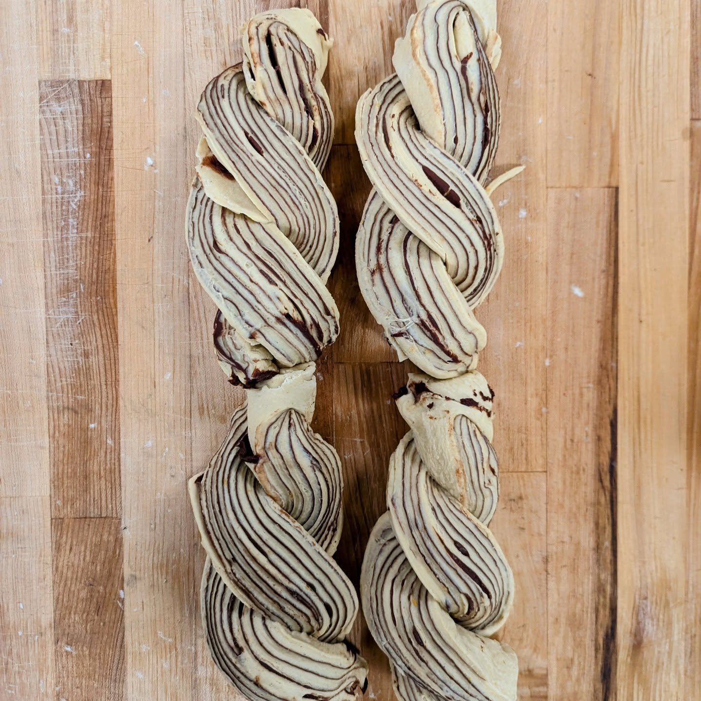 Chocolate babka, before and after.

One of our favorite breads to shape in the bakery, let alone eat! This bread has a soft crumb that is just strong enough to hold up the layers and layers of chocolate ganache. The result is something that's both ri