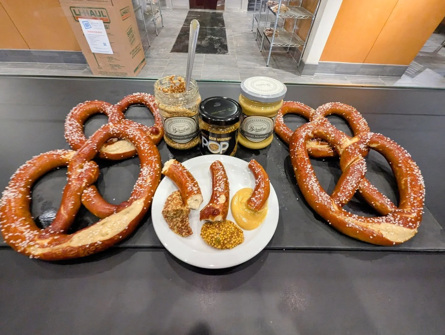 Happy pretzel day at the bakery!

Every Thursday we bake up a batch of rye sourdough pretzels! The rye sourdough starter gives these a more complex flavor than a typical pretzel. But thanks to the hand dipped lye process, they still have that traditi