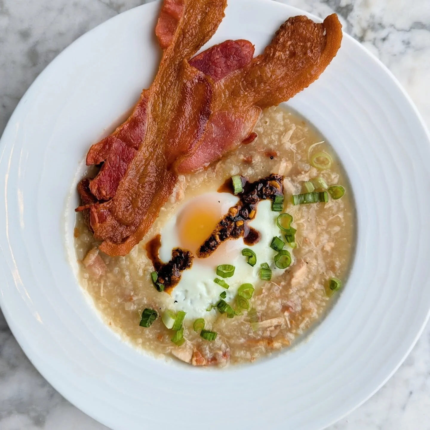 Sunday's brunch special is a breakfast jook!

If you're a regular at the bakery, you're familiar with jook season! The bitterly cold, most brutal time of winter is when we serve up our most warming soup! Our jook is a type of congee, or rice porridge