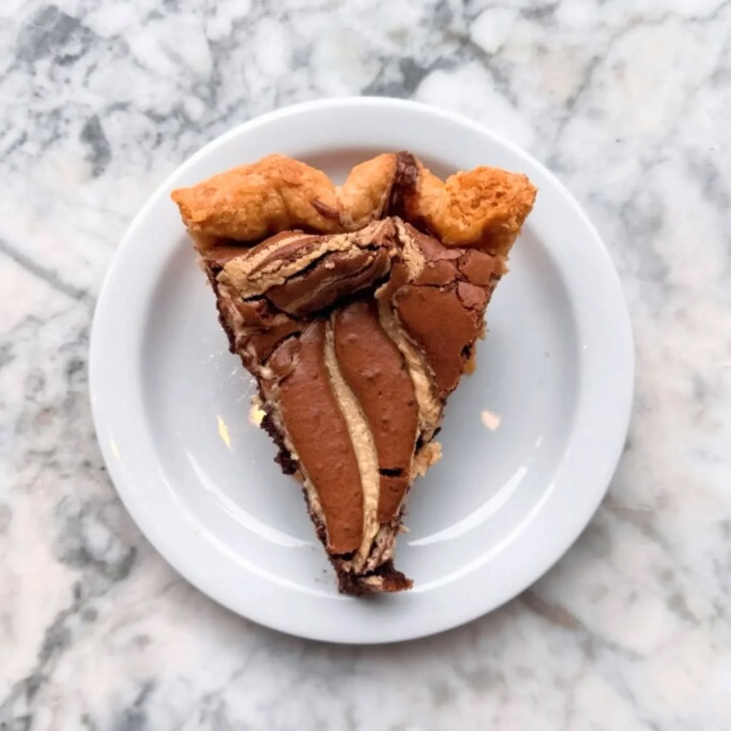 A Pi Day dark horse! Julia managed to find some time to bake a chocolate tahini chess pie! This one has been in the works for a future holiday, so consider this a sneak peak. Rich chocolate crumb in a flakey butter crust, swirled with ribbons of tahi