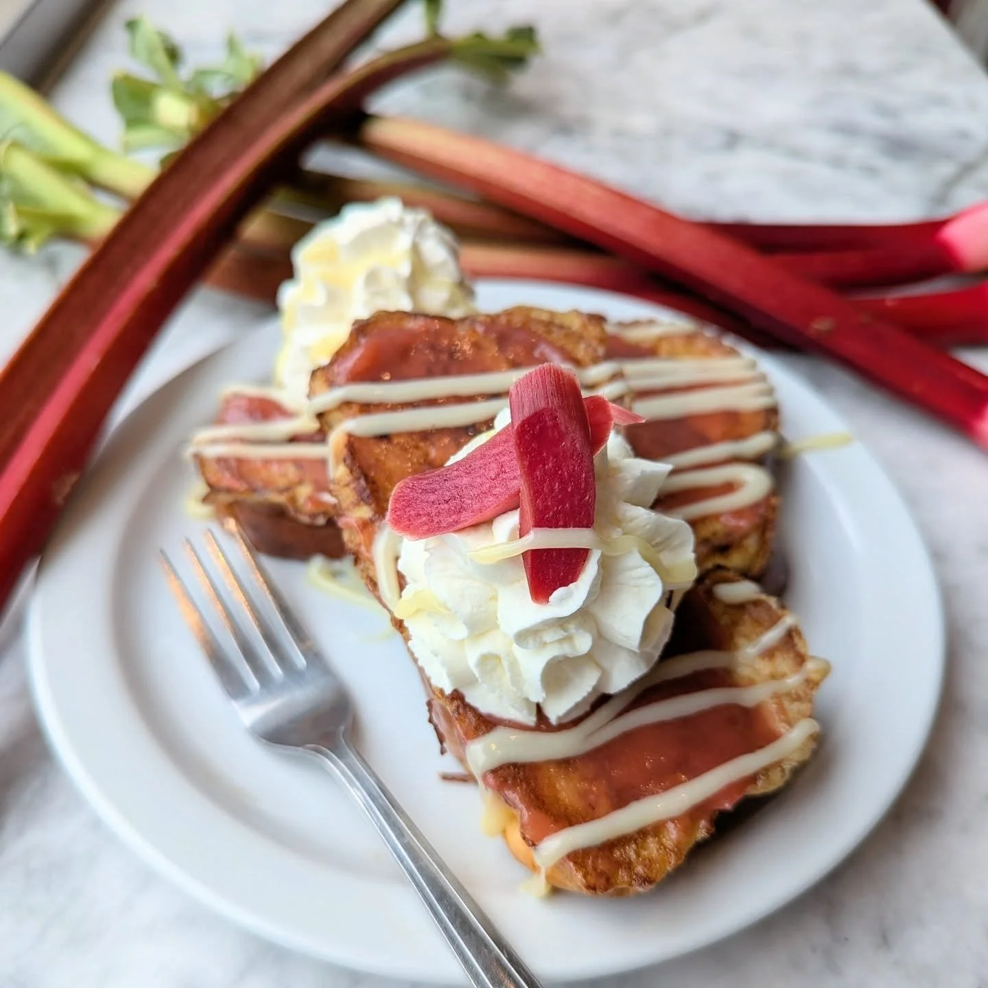 Happy Memorial Day Weekend! We are open Sunday with a terrific rhubarb French toast special.

Custard challah with a rhubarb compote, whipped cream, white chocolate ganache, and sous vide candied rhubarb! The rhubarb isn't just for show, it's my new 