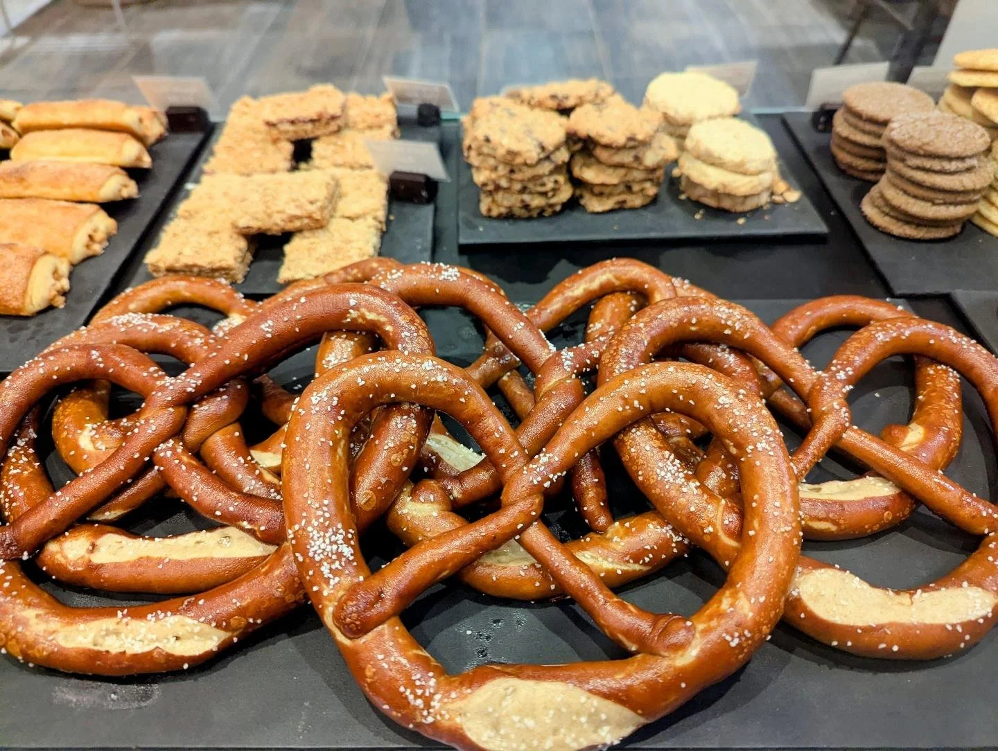 Happy pretzel day!

Every Thursday we serve up our lye bathed rye sourdough pretzels! The long natural ferment of the eye flour combined with the hand dipped lye bath make for a truly unique and flavorful pretzel.

We don't like to throw this word ar