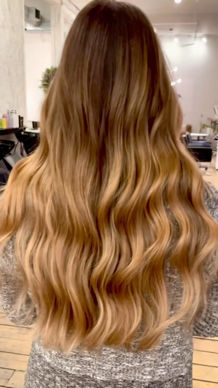 Long balayage waves with golden ombre, from the back