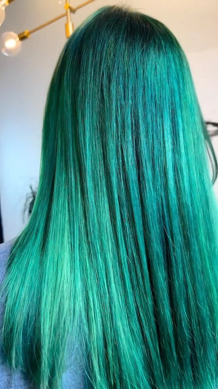 Long hair dyed vivid green, back view