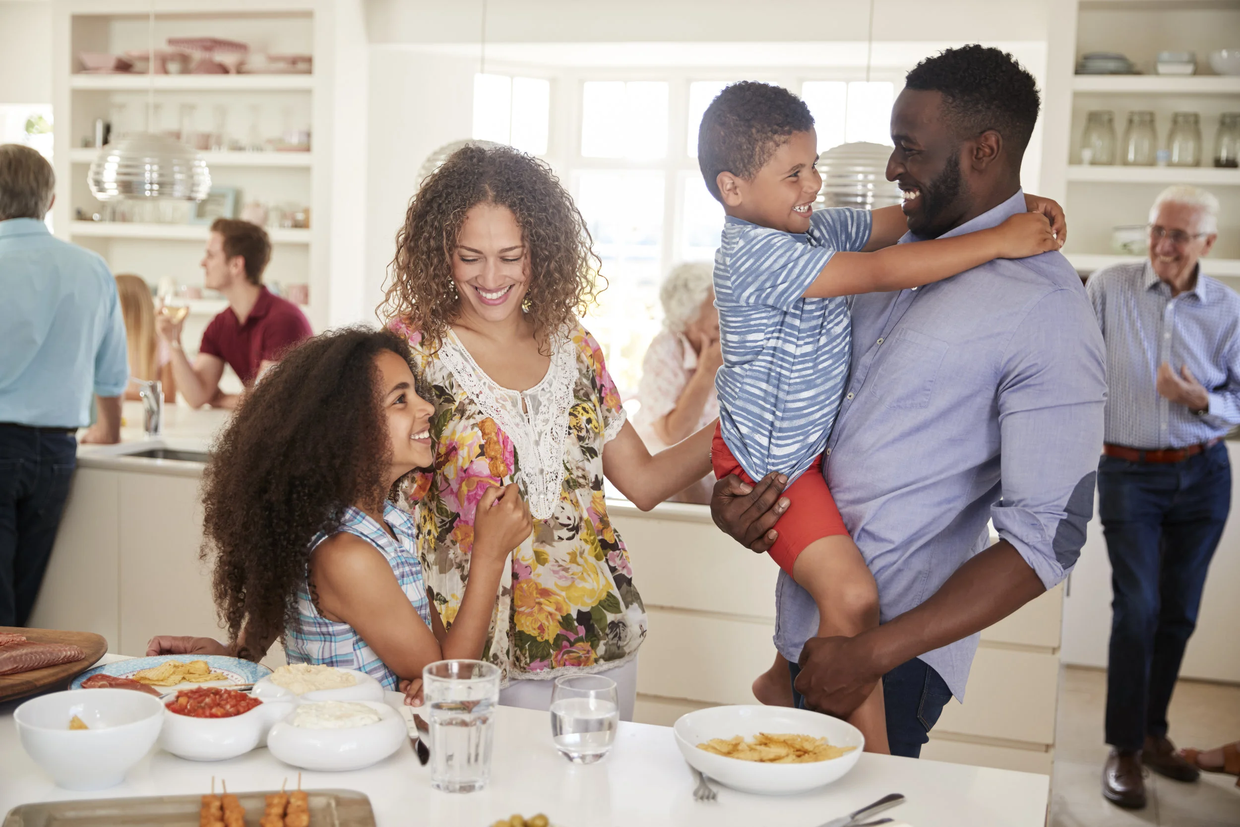 multi-generation-family-and-friends-gathering-in-RLEXCQT.jpg