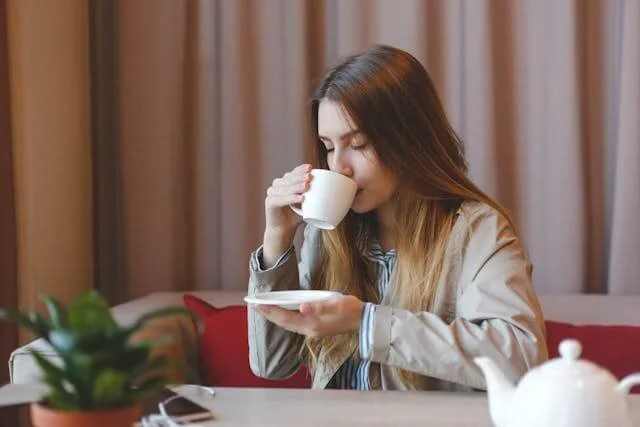 A girl drinking a cup of tea