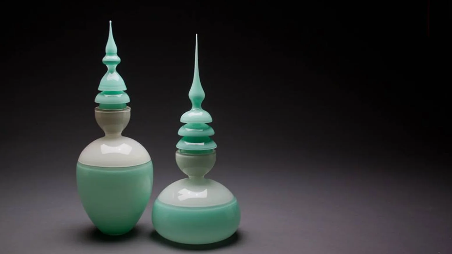 Glass artist Ryan Thompson explores vessels in many forms, both functional and nonfunctional. Ryan’s current body of work is an investigation of form and color relationships in contemporary vessel design. Inspired by ancient Japanese and traditional Western vessels, these exaggerated nonfunctional forms allow the viewer to disregard any assumed usefulness and appreciate the conversation and identity each color and form possesses.