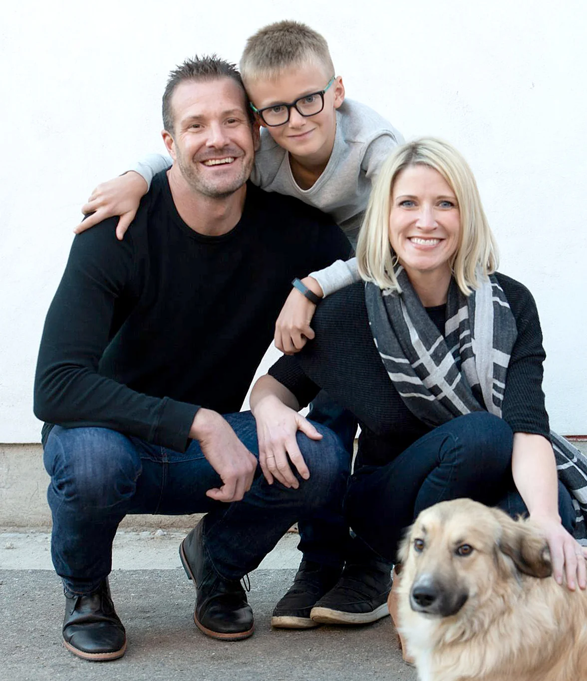 Jamie with her husband Chris, her 8-year old stepson Jackson, and their dog Bru