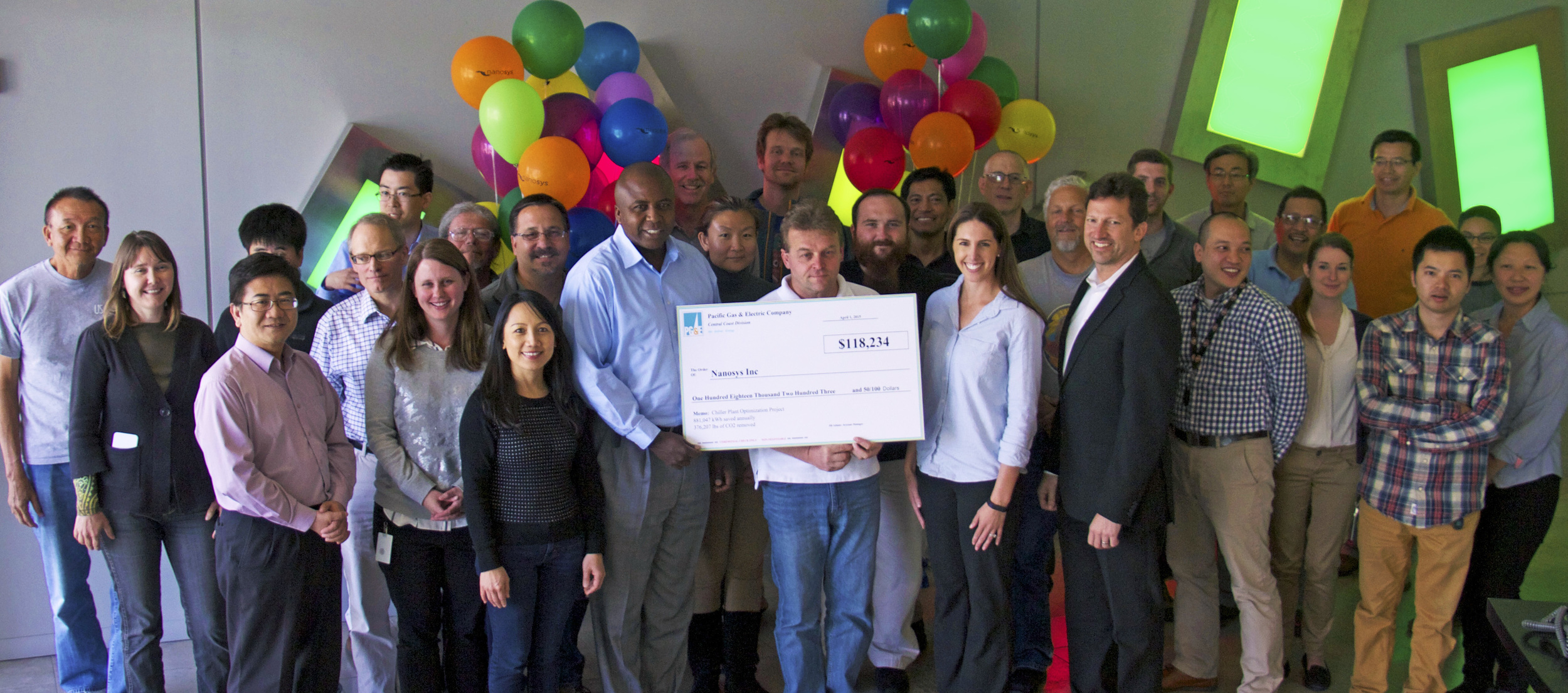 PG&E representative Jill Adams presenting the Energy Efficiency Program incentive check to the team at Nanosys for energy savings of over 800,000 kWh at the company’s Milpitas, CA headquarters