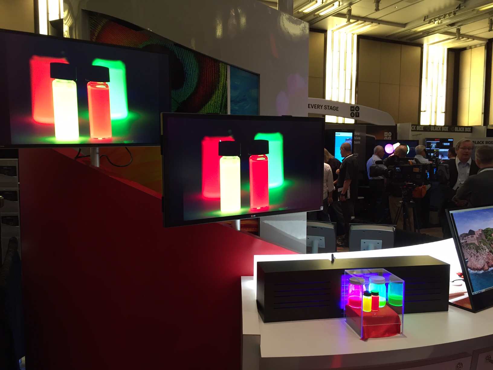 Rec.2020 Quantum Dots on display at SMPTE on a rec.2020 display! In the above demo, 3M is showing red and green Quantum Dots with rec.2020 wavelengths (clear box at lower right) next to an accurately reproduced image of those same dots on the 93% rec.2020 display (above and left).