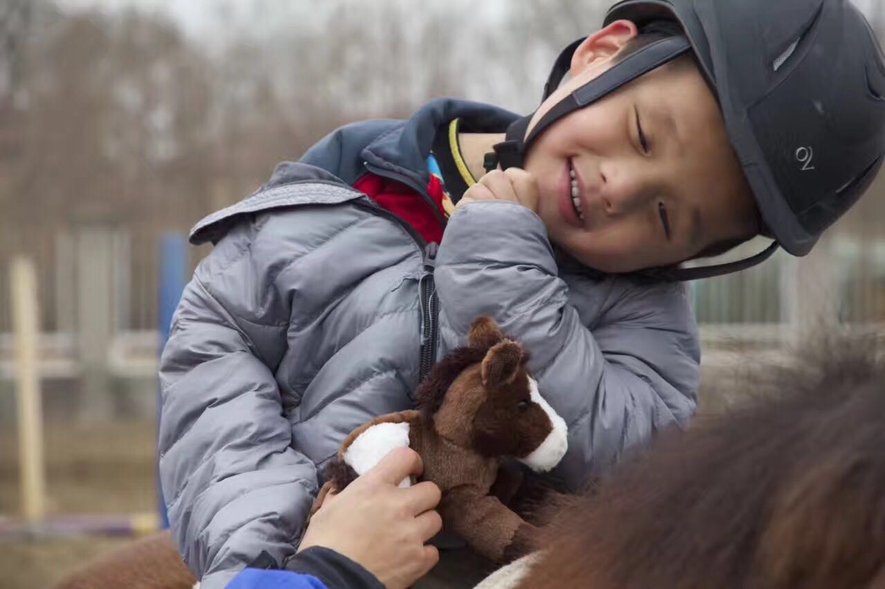 Child with Toy Horse