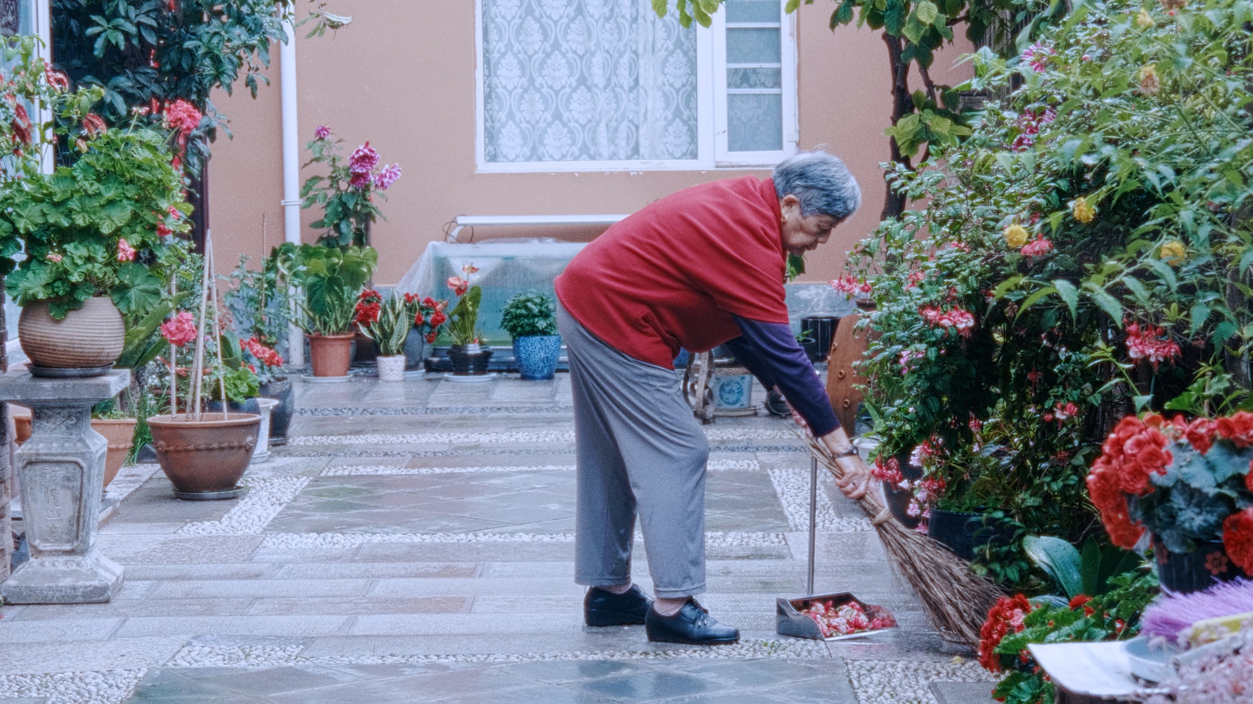 Heaven Rain Flows Sweetly_Still_Grandma in her Garden.jpg