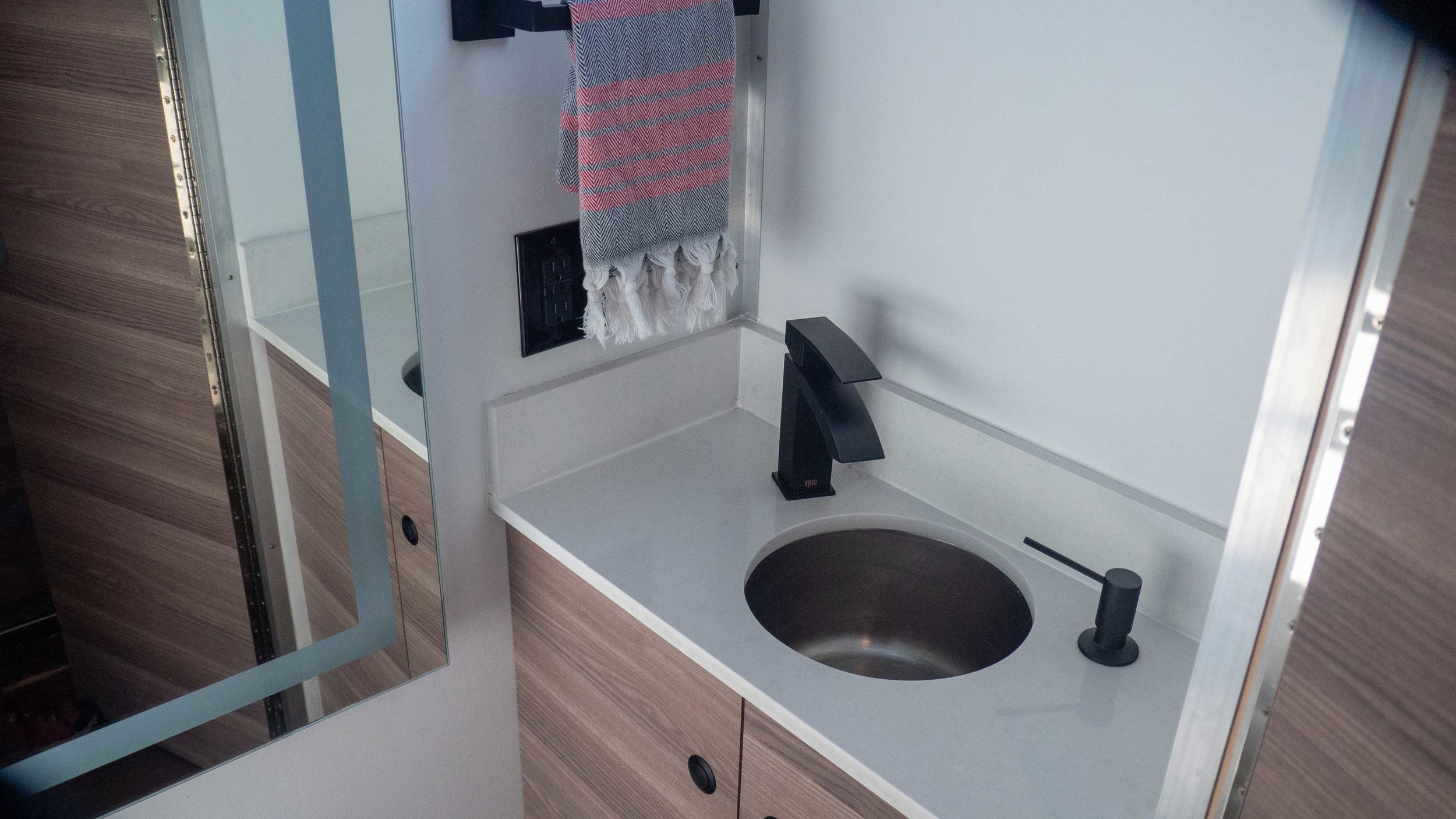 wash room includes under-sink & over toilet cabinets