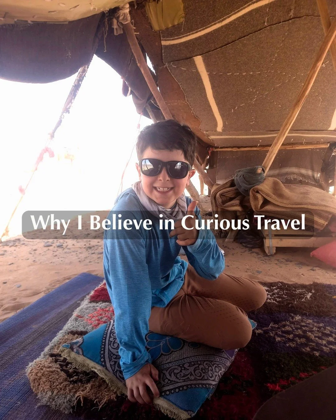 Curious travel is about curiosity, connection, and presence.
This photo of my son was taken during a stop in the Moroccan Sahara, in the midst of a three-day horseback riding trip. 
Our guide stopped at a simple tent where we met a woman he knew an