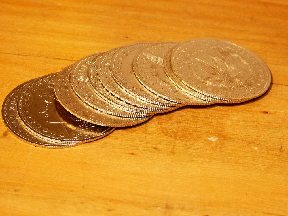 10 Thin Palming Morgan Dollars — product photograph