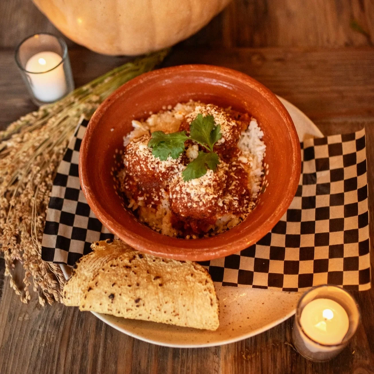The kind of dish that feels like a warm hug, a family recipe, and a chef&rsquo;s kiss all at once.

Albondigas con Arroz
Grass-fed beef + pork meatballs, slow-simmered in a rich chipotle chile tomato sauce that hits that perfect balance of smoky, sav