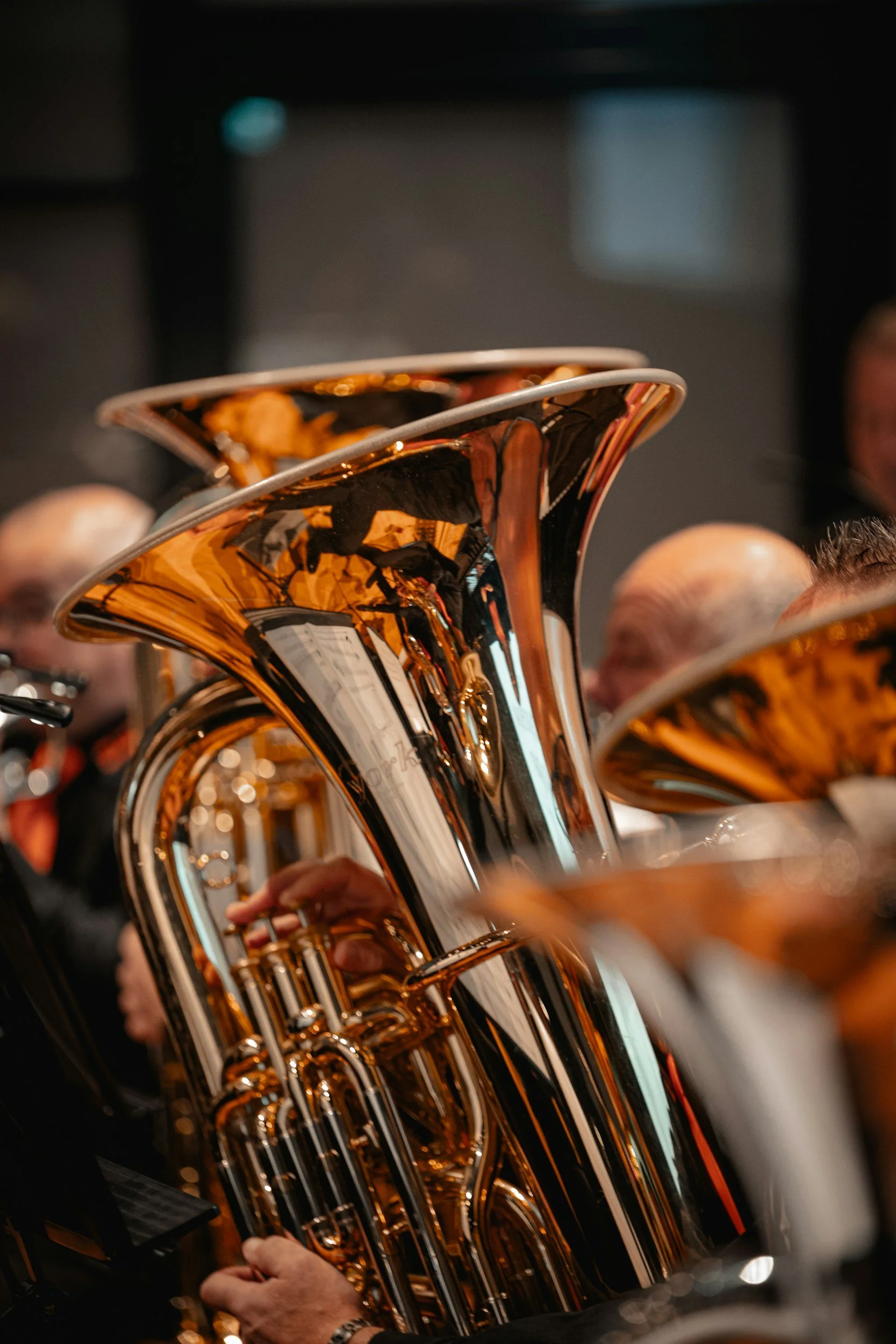 Tuba player sitting in a concert band